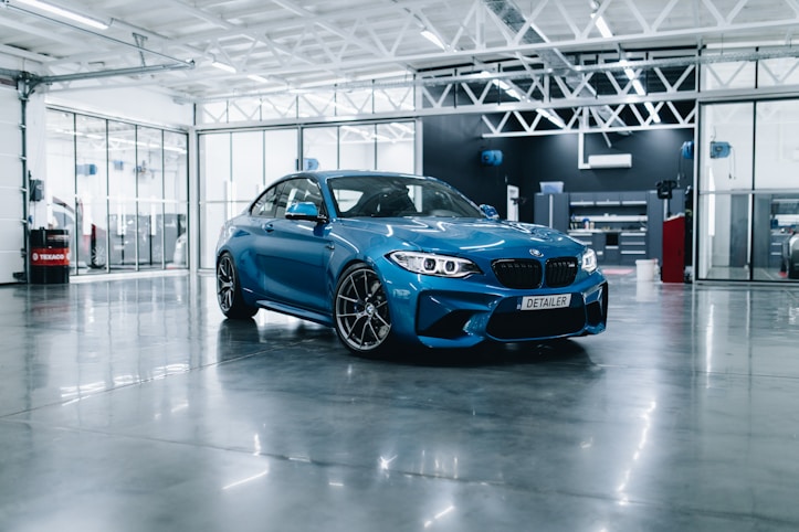 Blue BMW in an executive showroom