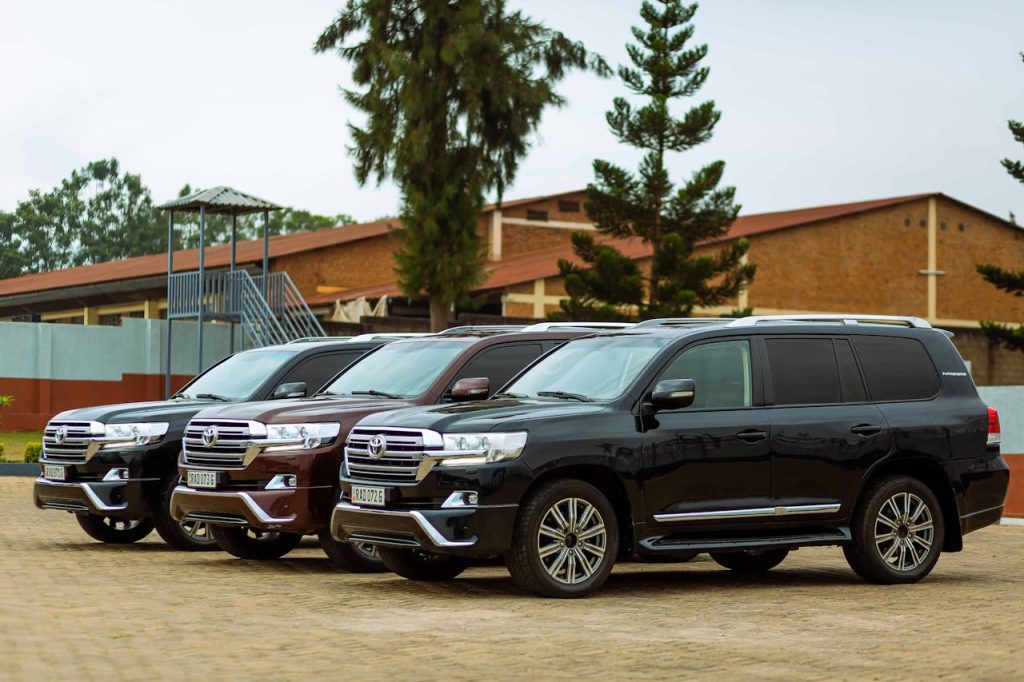 Vancooop Car dealership Three Toyota Land Cruiser SUVs parked outdoors on a sunny day.