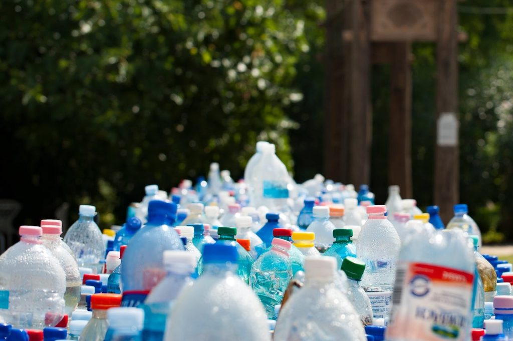 vancoop water A vibrant collection of plastic bottles in an outdoor recycling setup, showcasing environmental awareness.
